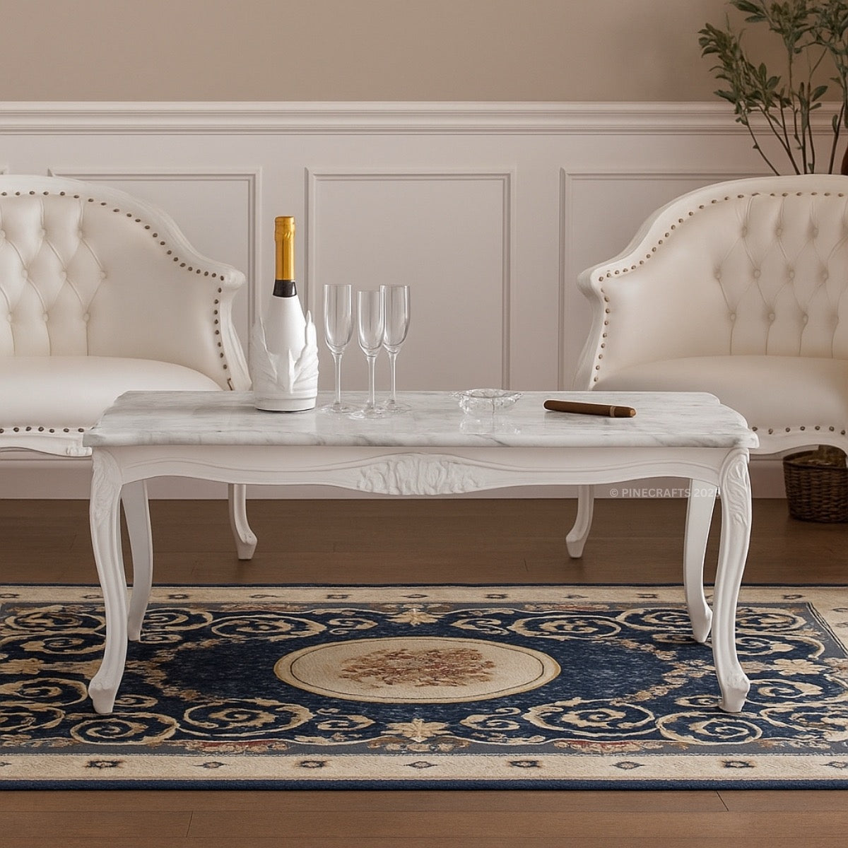 Living room with marble coffee table, white armchairs, and decorative rug.
